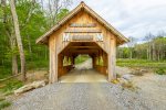 covered bridge at the entrance of property